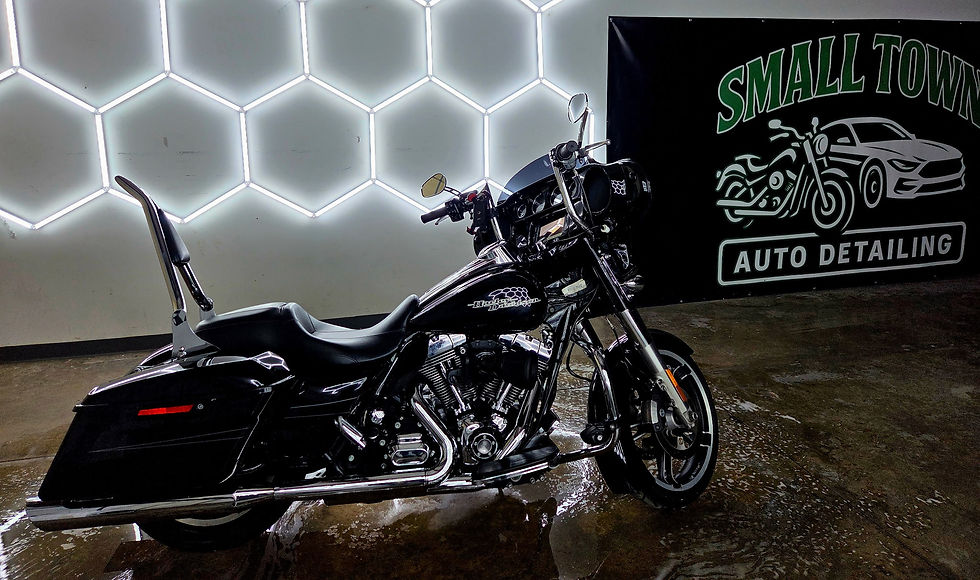 Black cruiser motorcycle at Small Town Auto Detailing