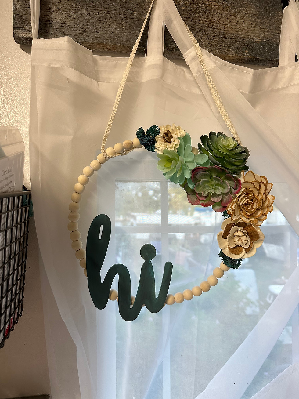 Thumbnail: Beaded wreath with cluster of flowers and "hi"