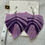 Thumbnail: Purple feather earrings