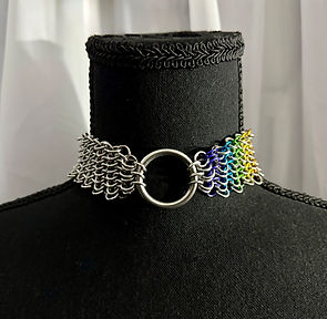 Stainless Steel and aluminum rainbow collar with stainless steel O-ring. Chainmail weave is european 4 in 1. The right half of the luxury bdsm collar is made from rainbow chainmail in support of lgbtq+ pride.
