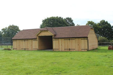 Oak framed garage - 5 bay with higher central bay for larger vehicles 