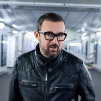 A picture of Judge Jules in a black leather jacket