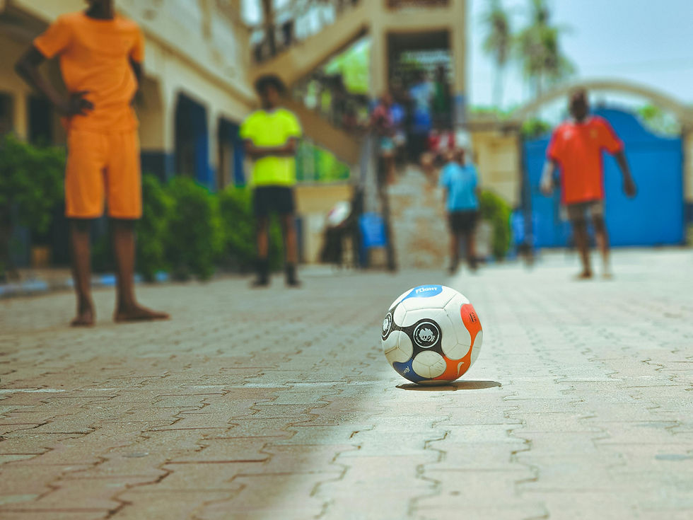 Children playing soccer as part of our brand story