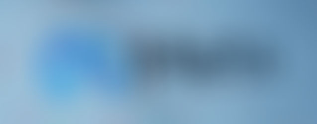 Close-up of pixelated screen showing the word "Meta" in blue and black on a grid background, with colorful dots scattered throughout.