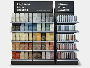 Shelves displaying diverse colored bags and tubes of Kerakoll Fugabella Color and Silicone, with designer Piero Lissoni's name noted.