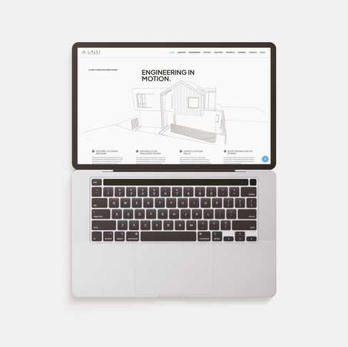 Lalli Engineers website mockup on a floating mac book pro laptop
