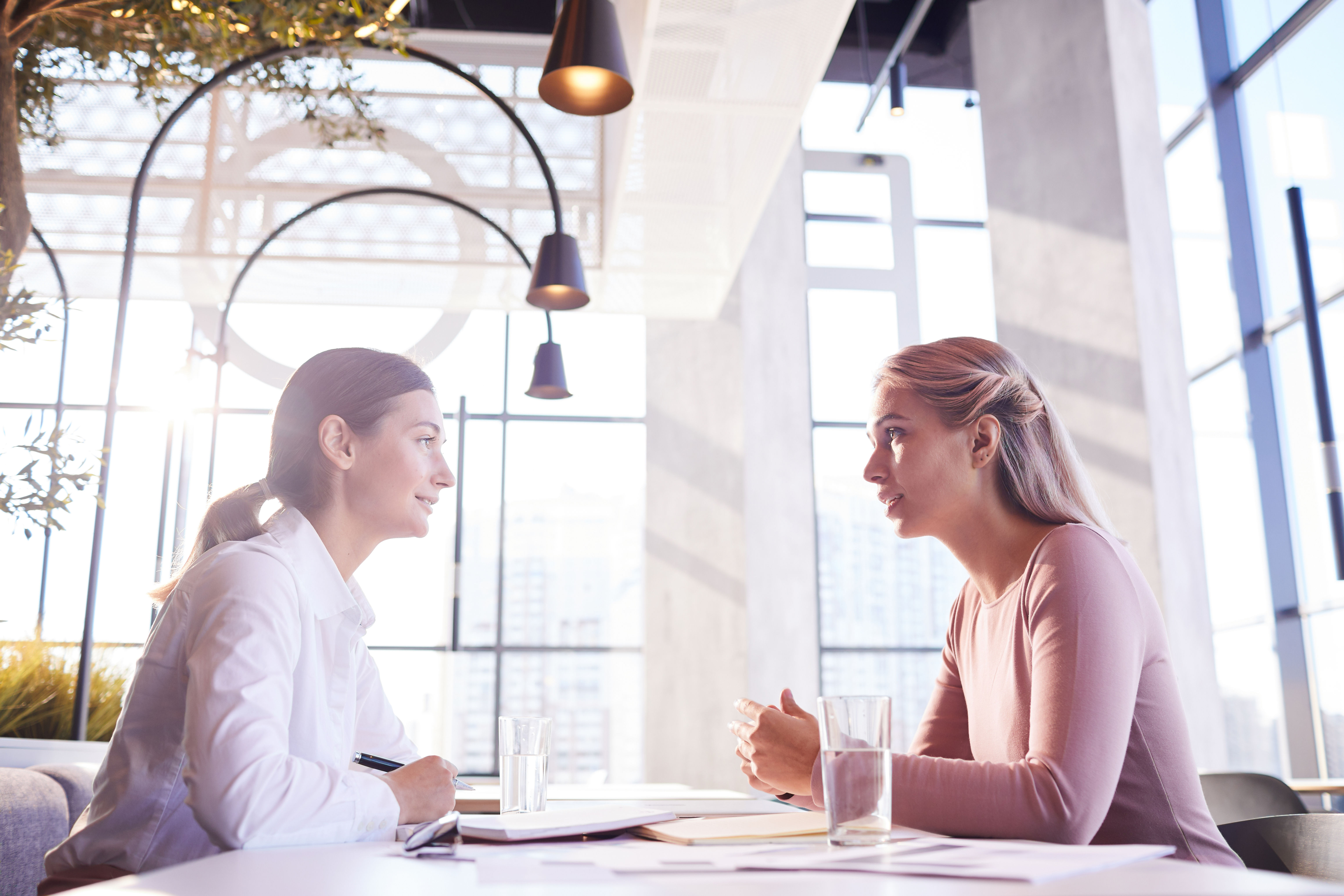 Two women meeting up, expressing relief and happiness