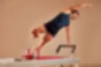 handsome-pilates-male-instructor-performing-stretc-2023-11-27-05-06-44-utc-scaled.webp
