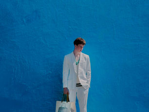 MAN STANDING BEFORE THE WALL