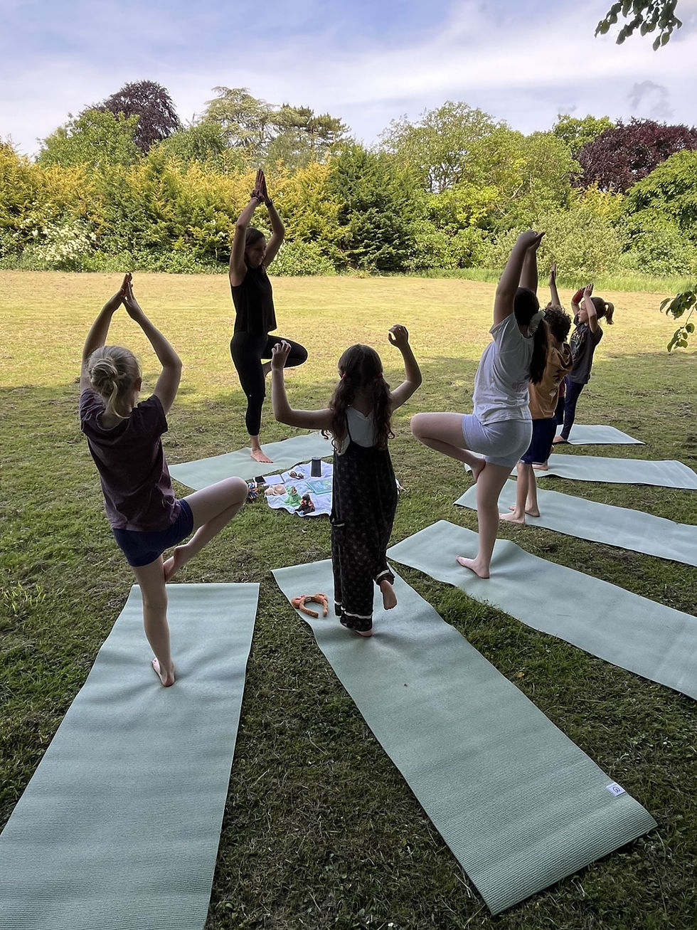 Eye-level view of a child practicing yoga outdoors