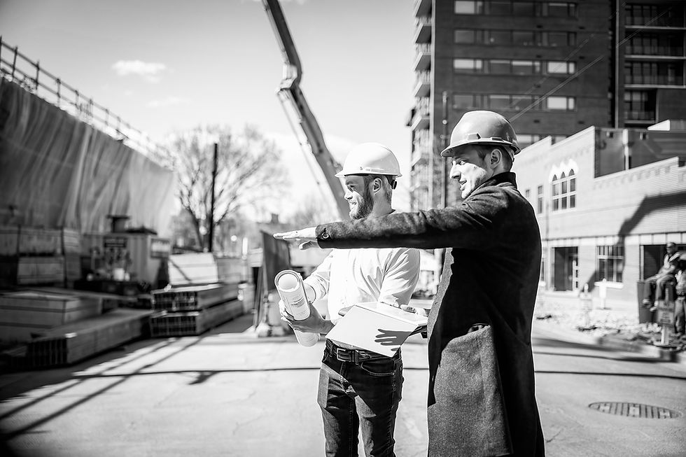 Architects Anthony Gengaro and Seth Donnell reviewing a build site