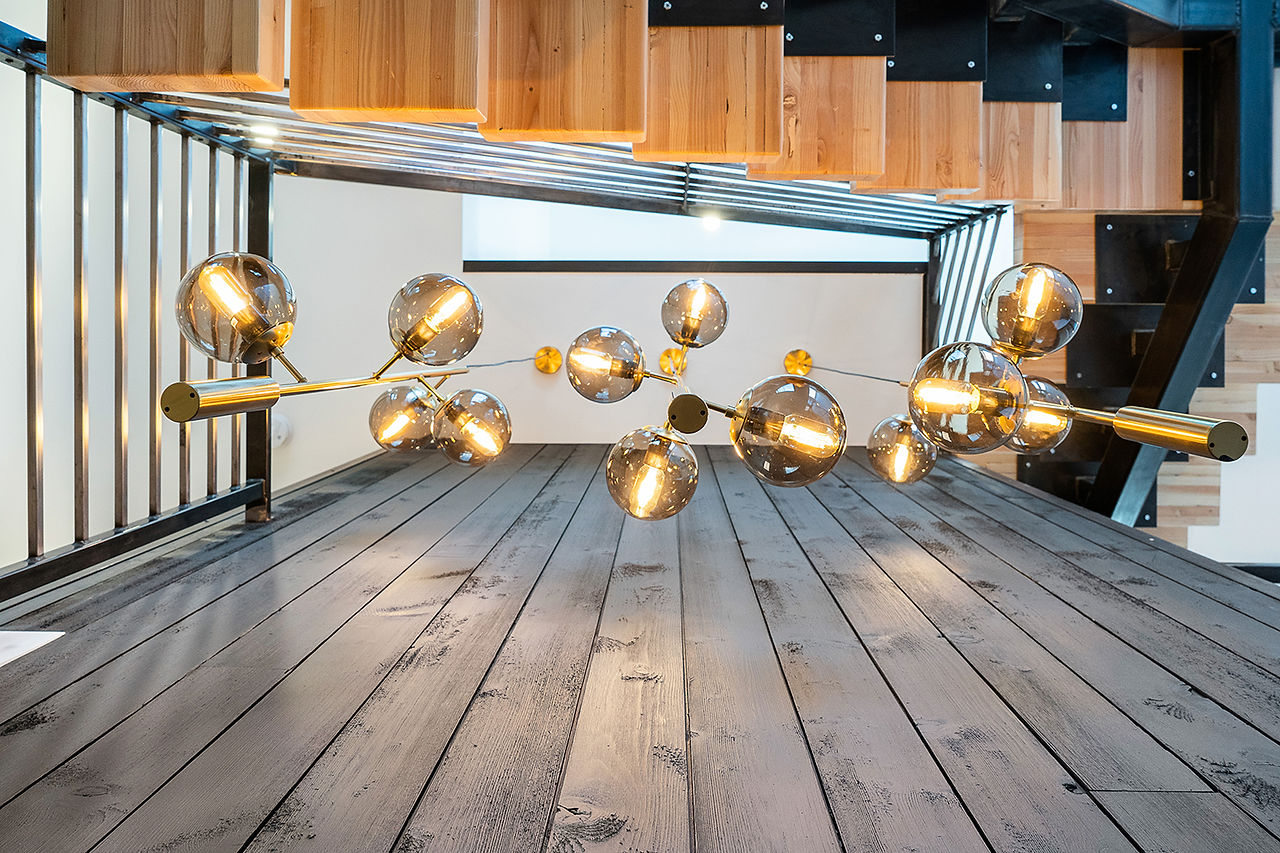 Pendant light fixture detail with warm metal finish