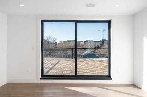 Bedroom with large window and minimalistic design
