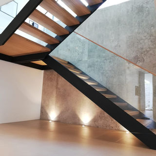 floating staircase with glass railing