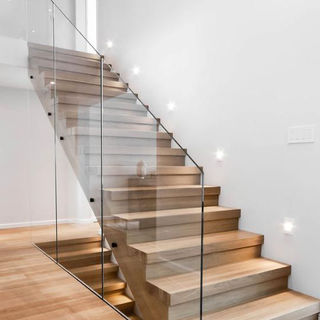 floating staircase with glass railing
