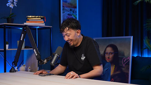 Funny guest laughing in front of custom backdrop modern podcast studio Dubai Dubai podcast studio