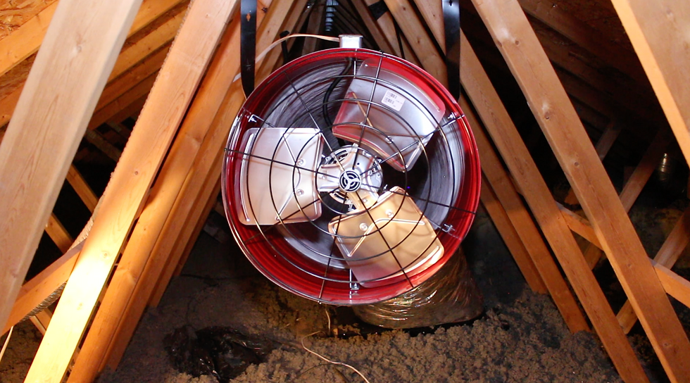 Quietcool whole house fan mounted in an attic with new insulation from Colorado Home Services