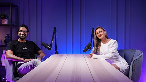 Two guests podcasting at white table with purple lighting podcast studio Dubai setup Dubai podcast studio