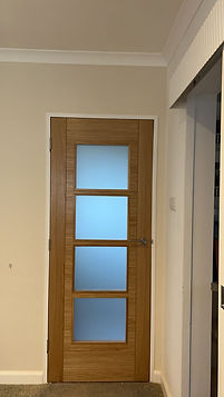 bespoke wooden door with frosted glass windows