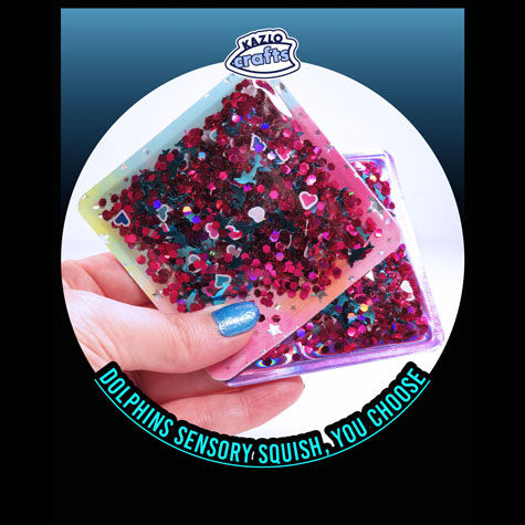 hand holding 2 versions of dolphins and hearts cute stress toy