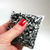 sensory squish pouch with black and white glitter
