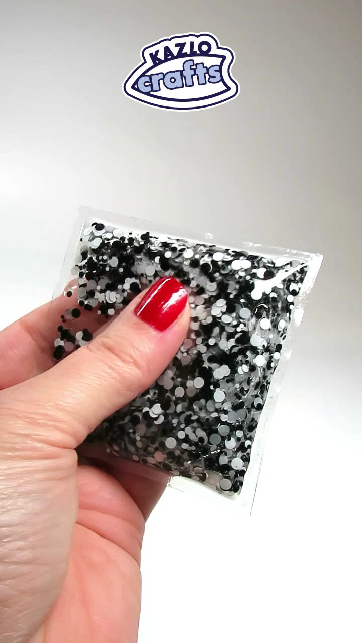 sensory squish pouch with black and white glitter