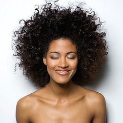 Portrait of a Smiling Woman with Curly Hair_edited_edited.jpg