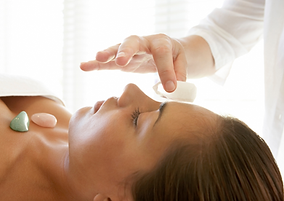 a lady having crystal reiki