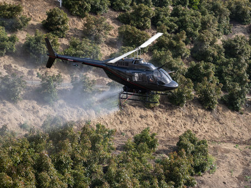 Helicopter spraying agent orange herbicide