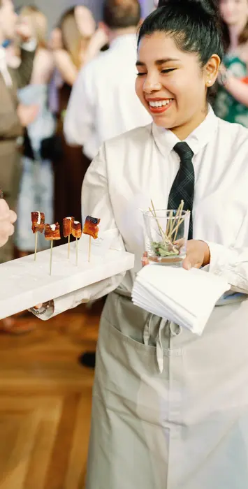 Ridgewells Catering server offering passing hors d'oeuvres