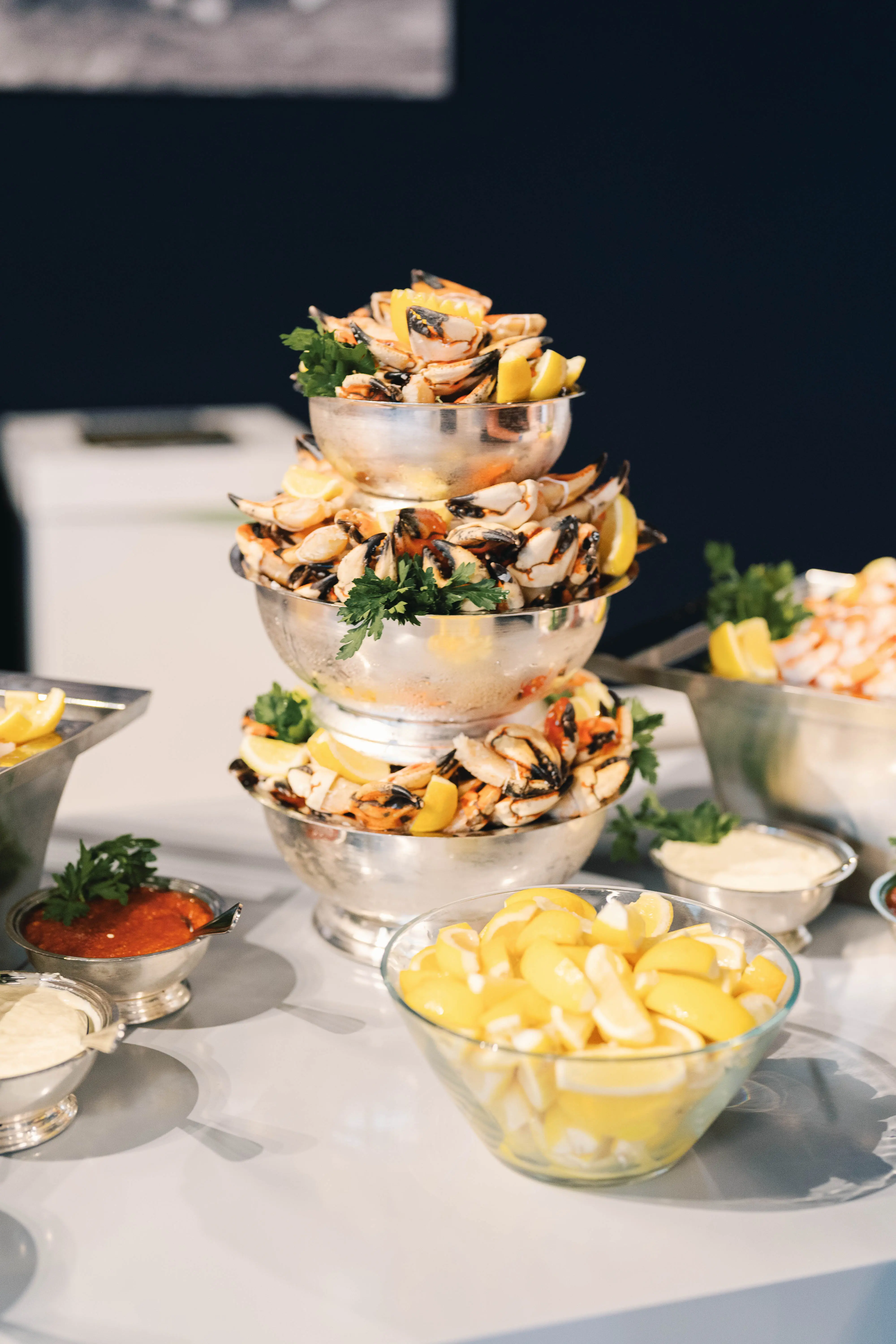 stacked silver tower of fresh crab legs