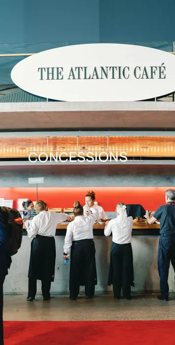 Servers setting up buffet at arena stage