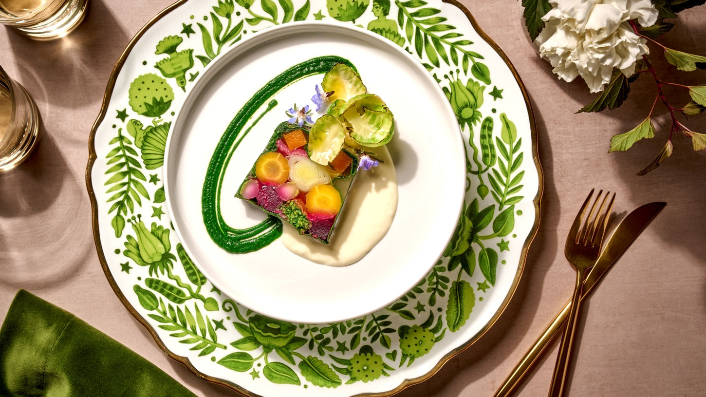 Artistic vegetable mosaic with green sauce on floral china, Ridgewells Catering in Washington DC.