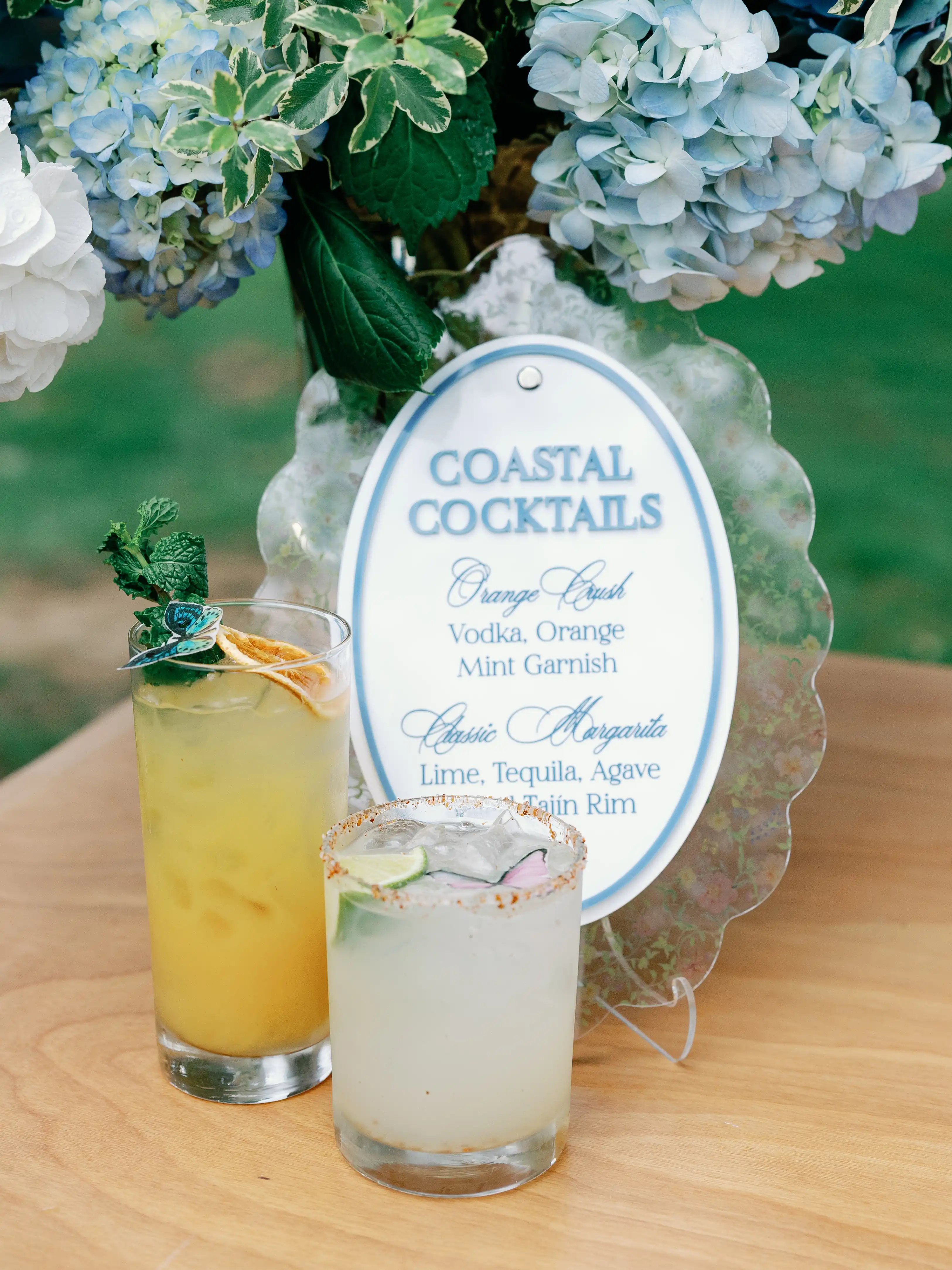 orange and white, bright cocktails in short and tall glasses