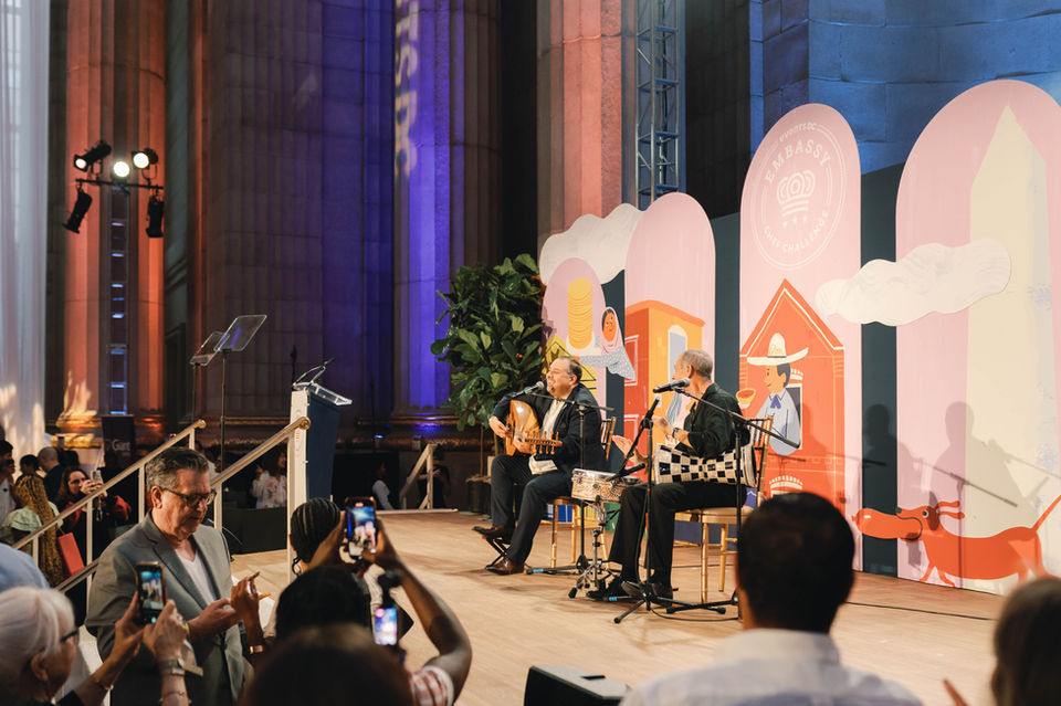 Musical performers on the stage at Andrew W. Mellon Auditorium