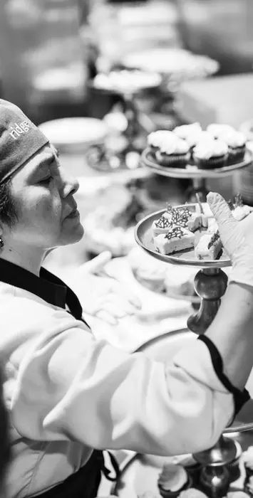 Chef setting up dessert tower