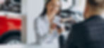 man-with-sales-woman-car-showroom_edited.jpg