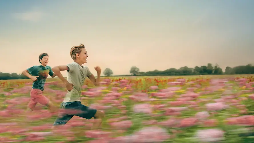 Kids running in a field 