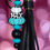 Thumbnail: Black Key Chain with Pumpkins and Tassel. Bubble Gum. Black background