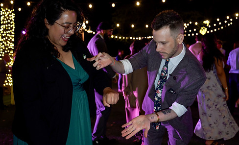 Close-up magician amazes woman at wedding reception in San Jose CA