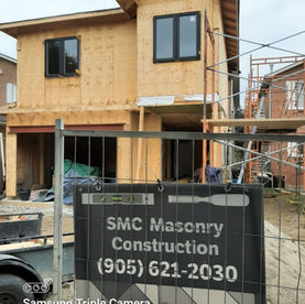 New house under construction in Whitby before natural stone veneer installation by SMC Masonry