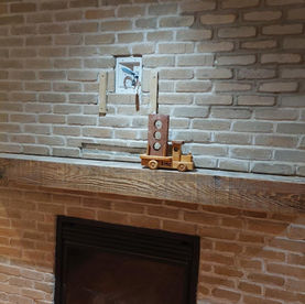 Custom stone fireplace in Whitby built by SMC Masonry showing finished natural stone masonry and detailed craftsmanship