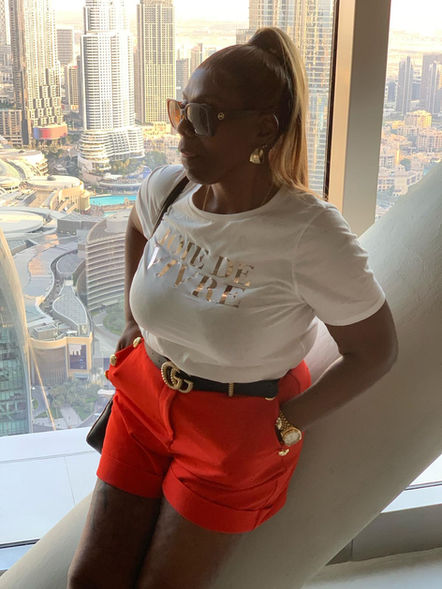 Jennifer posing with beautiful skyline behind her