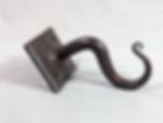 Thumbnail: A handmade wrought iron hook with a forged metal backplate
