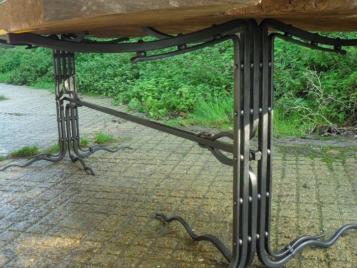 Detail of wrought ironwork dining table legs forged by Tom Fell - Blacksmith