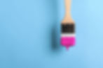 paintbrush-with-dripping-purple-paint-on-blue-back-2022-07-28-20-06-28-utc.jpg