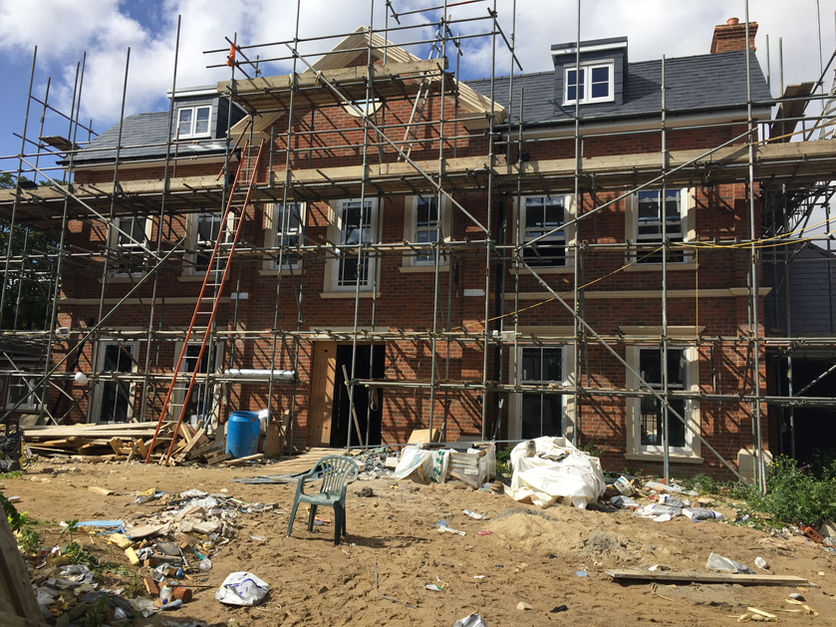Building under construction with scaffolding,