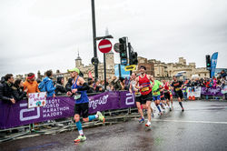 Tom Negative Split online running coach at the London Marathon April 2023 crossing Tower Bridge at m