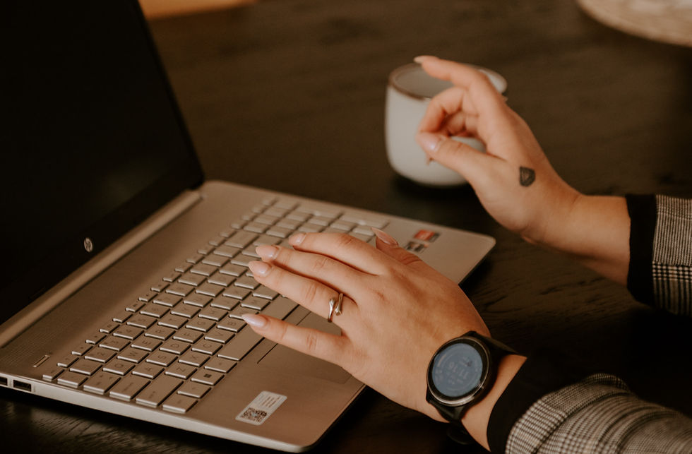 Hands at lapop keyboard.