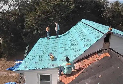 Roofer walking on a pitched roof during a residential roof inspection.